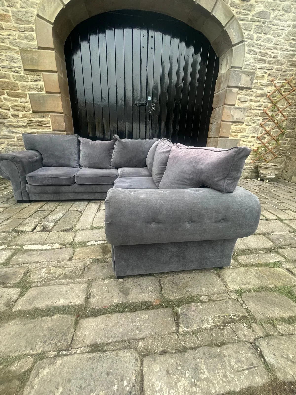 Grey modular sofa with matching footstool